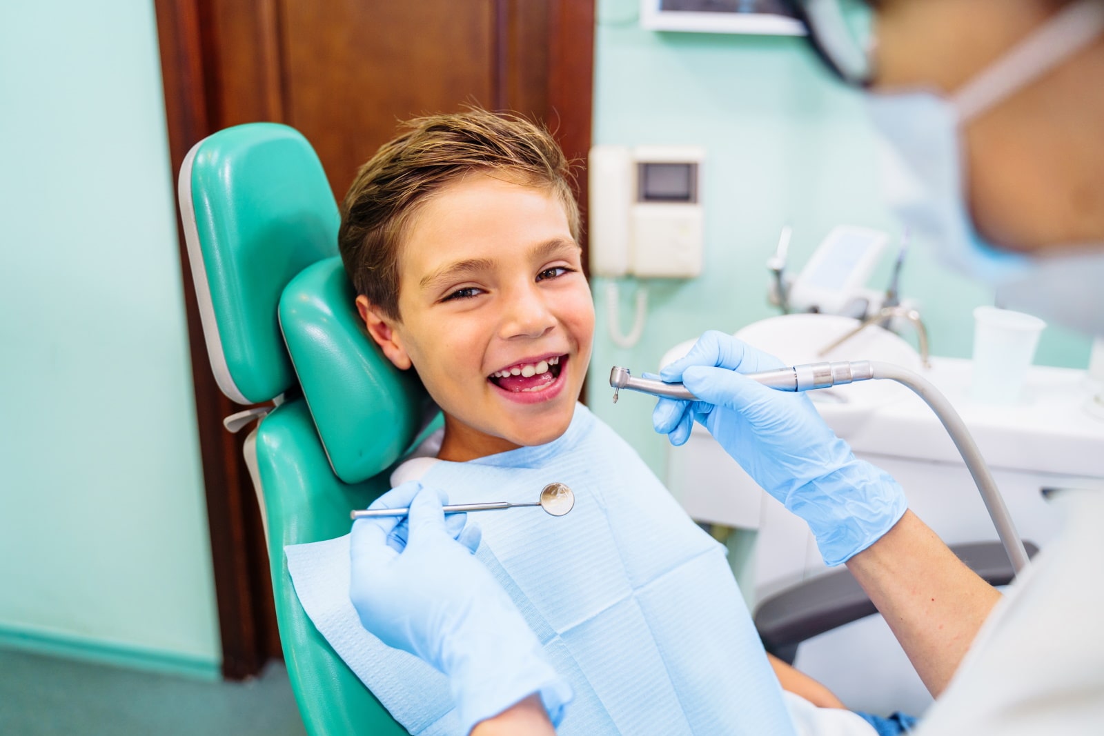 Child Smiling At Dental Office